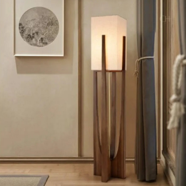 Minari, a sculptural floor lamp with a forked wooden base and square linen shade.