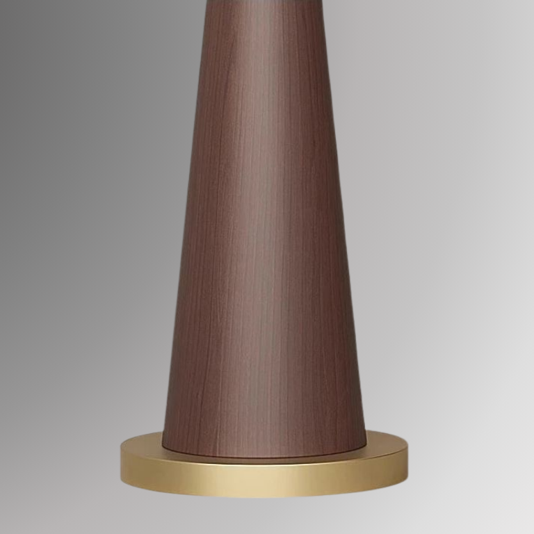 Close up showing Ellis' coned base details, featuring a wood grain design in deep brown sitting on a gold plated iron base. All against a greyscale background.