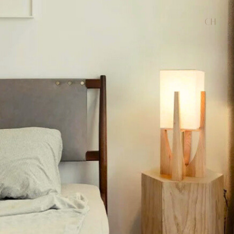 Minari, in it's 20" height option, featured on top a wooden bedside table.