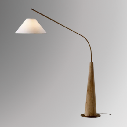 Ellis, a modern floor lamp with a light brown base and a tapered golden arm on a greyscale background.