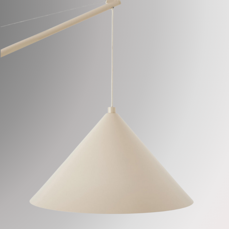 Detailed and zoomed shot of Quentin. Showing its beige cone-shaped pendant shade against a gray background