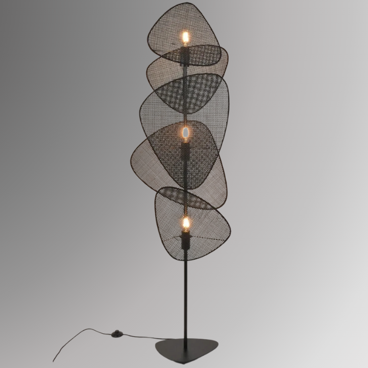 Saray, an iron based floor lamp with 3 light sources and 5 leaf shaped wicker shades, pictured in its black finish.