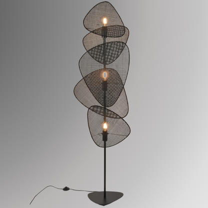 Saray, an iron based floor lamp with 3 light sources and 5 leaf shaped wicker shades, pictured in its black finish.