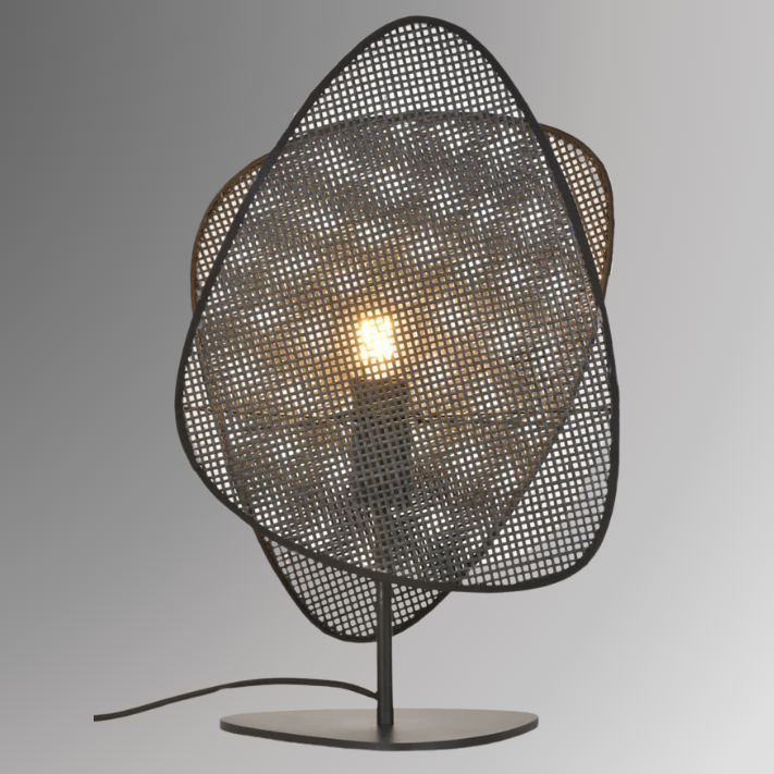 Saray, in 20" table option, featuring two leaf shaped wicker shades. Pictured in its black finish, against a greyscale background.