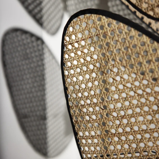 Close-up shot of Saray's textured woven rattan shade, with shadows highlighting its unique silhoutte.