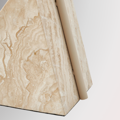 Detailed and zoomed shot of Quentin's triangular stone base. Pictured against a greyscale background.